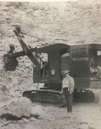 W. T. Liter beside a cable shovel at the quarry, 1949