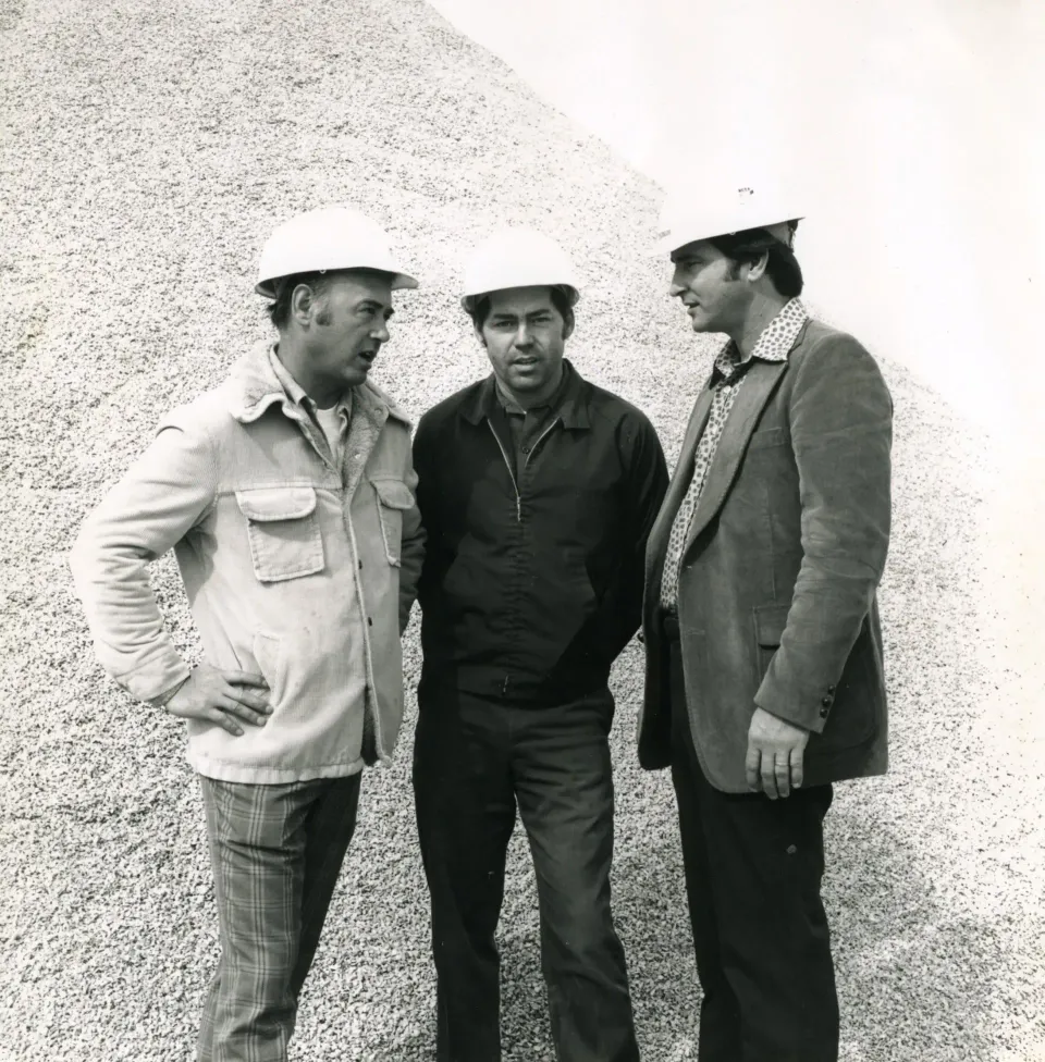 Gene Liter, Ernie Mckinney and Bob Liter at a stockpile, 1975
